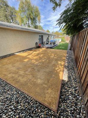 Decomposed gravel, decorative rock, and artificial grass.