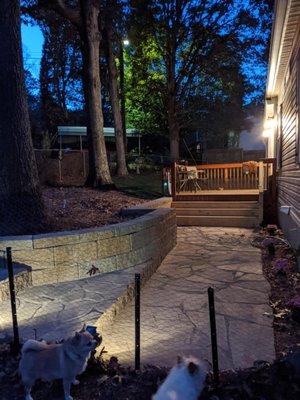 split-face retaining wall with flagstone walkway and new deck