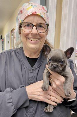 Dr. Laurie Noe getting puppy snuggles.