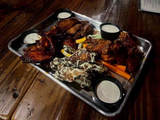 Top Left: Cajun Butter Bottom Left: Maple Buffalo Bottom Right: Wasabi Ranch Top Right: Buffalo