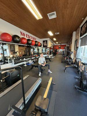 Owner of RehabPT, Dr. Chase Everwine, PT, DPT in the gym area of the clinic.