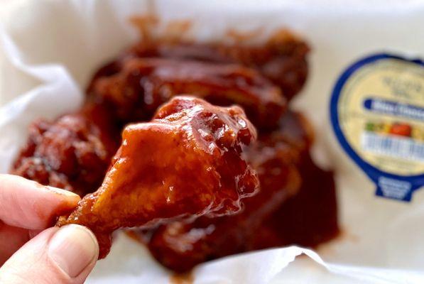 5 piece spicy honey bbq bone-in wings with bleu cheese and celery sticks below -takeout - great!