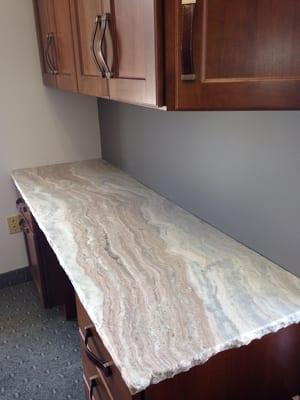 Cherry desk display with granite countertop, honed with chisel edge