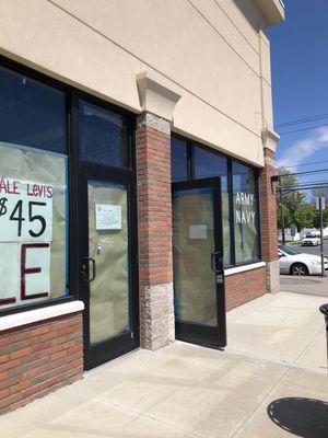 Sunflower Nails is moving to this corner store / that was for many years - the Army Navy store