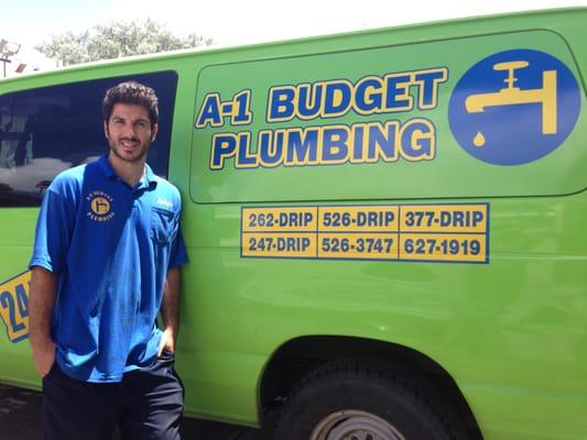 Our skilled Master Plumber stands proudly beside the A-1 Budget Plumbing van, fully equipped to tackle your plumbing emergencies!