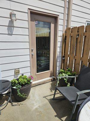 Impatient flowers, vines and plants in larger flower planters.