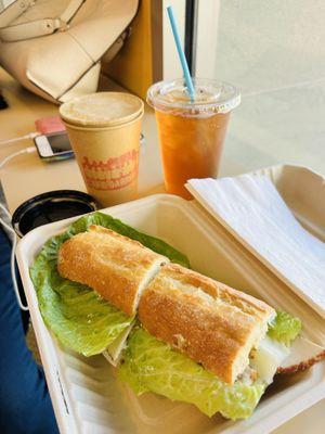 Top left: medium roast hot coffee w/ cream & sugar Top right: Iced Moroccan Mint Tea Sandwich: Peppered Turkey with Cranberry