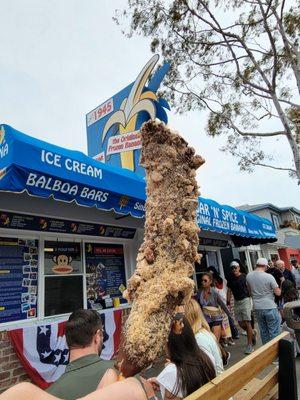 Frozen Banana with Premium Dark Chocolate Dip and toppings: Health Pecan Crunch and Reese's Peanut Butter Cup Crumbles ($6.25)