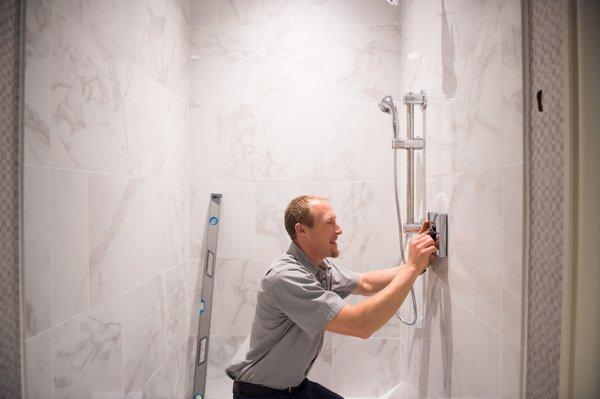 Ed expertly installs shower fixtures for a homeowner in San Mateo County