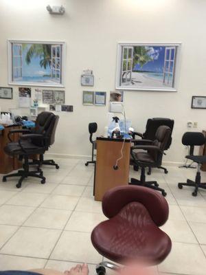 Sitting for pedicure looking at nail stations