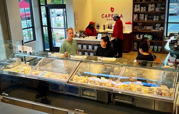 Impressive selection of cheese with samples to help you build your charcuterie broad.