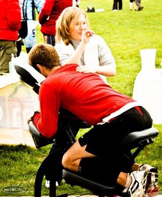 Chair massage post 1/2 marathon on athlete and Multisport Coach Porter Bratten.