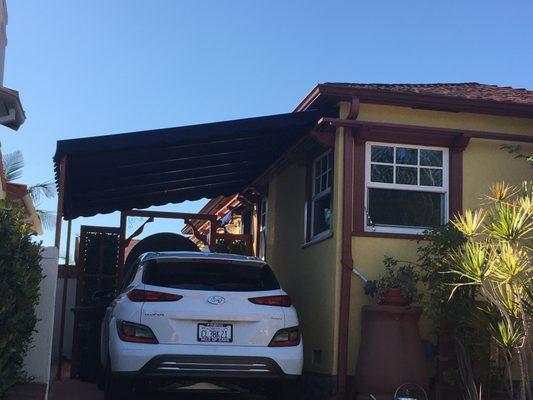 New Sunbrella Captain Navy carport awning.