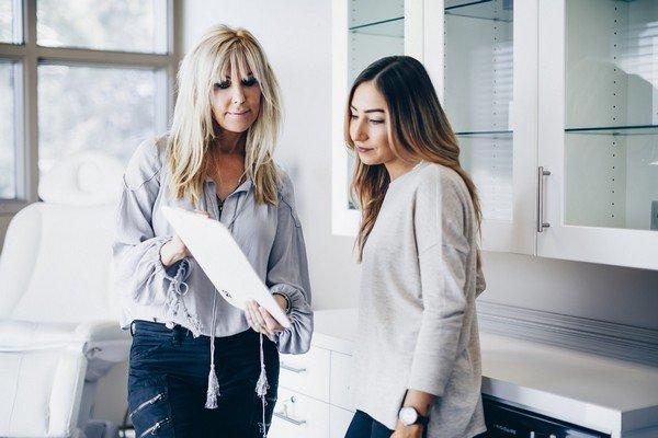 Tamra Bedford, consulting with a laser hair removal patient.