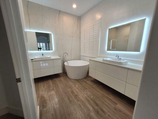 Soaking Tub, Plank Style Flooring and Modern Vanities