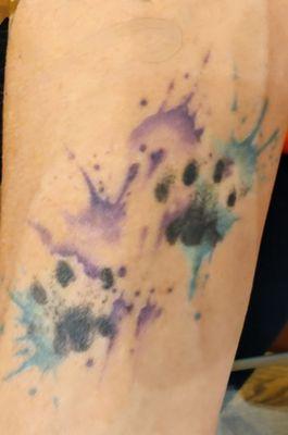 Tattoo, on my forearm, of my cat Eclipse's paw prints, with watercolor.  *Ink done by: Chelsea Wilson, owner of Pebbles Ink