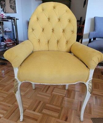 Beautiful tufting on this antique chair.