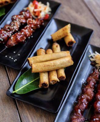 Traditional lumpia and chicken bbq sticks