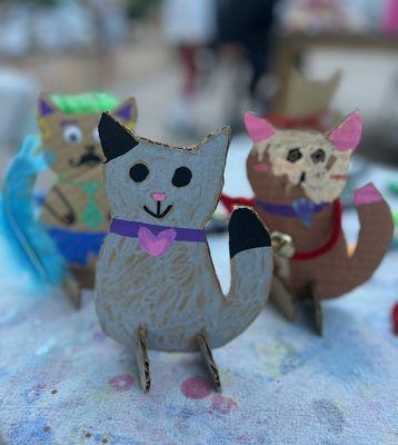 Creating cats at a cat themed birthday party!