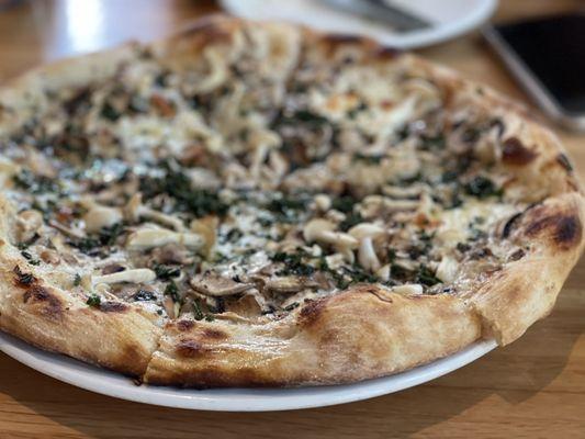 Mushroom pizza with Gruyère (so good. Incredible crust)