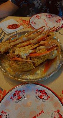 1 pound Cajun mild snow crab, 2 corn, 2 potatoes and a boiled egg.