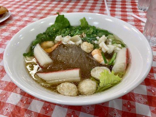 Hu tieu with chewy clear noodles, shrimp, fish balls, and calamari