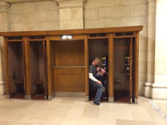 Ellie Schleider, my 2 year old daughter and I, using the old school phones at the New York Public Library with me, Natan Schleider MD.