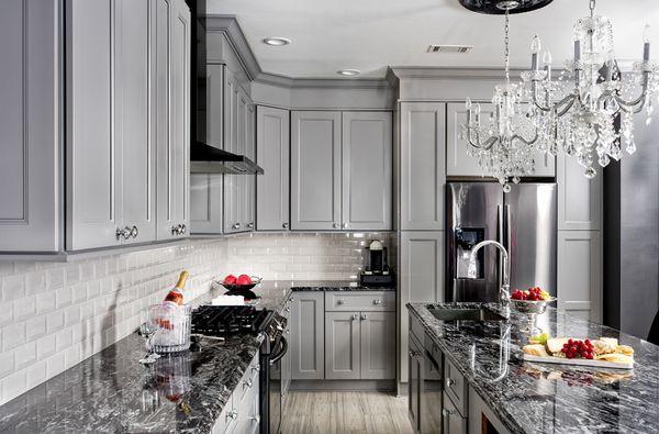 Grey cabinet with natural black countertop and white beveled subway tile backsplash!