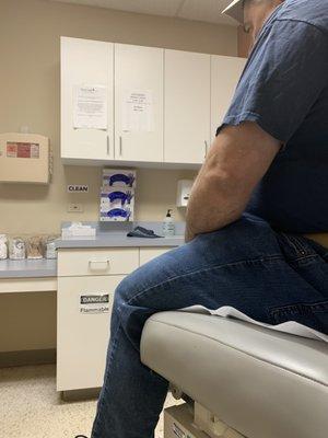 How small exam room was. Photo taken by wife sitting on floor behind door