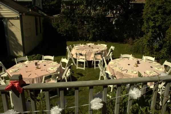 My backyard bridal shower. Tables, chairs, tablecloths, and glasses provided by Ace Party Rental.