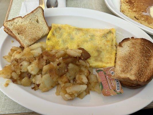 Sausage n Cheese omelette with home fries and salt rising toast.