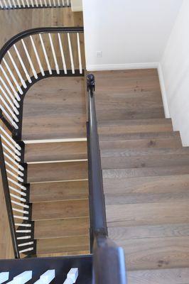 Prefinished flooring installed on staircase.