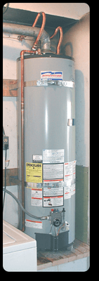 Photo of residential water heater with copper flex lines and T&P drain line running down the side of the tank and mounted on ...