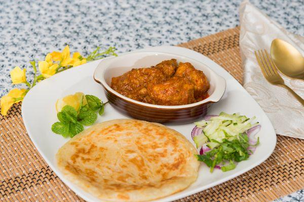 A must try Paratha with Chicken Curry dip 
 Burmese style crispy, buttery and layered pancake