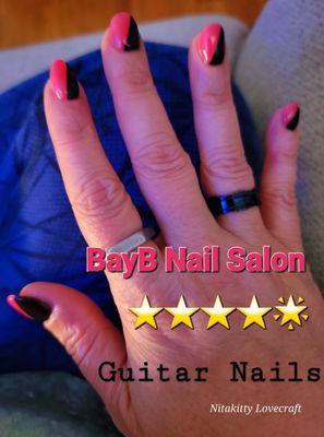 Guitar nails (right hand). Glow in the dark (pink but orange under blue and night light) and gel black- so satisfied!