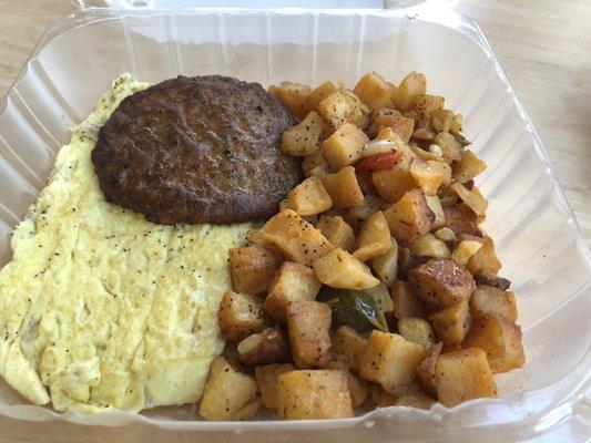 Three eggs with home fries