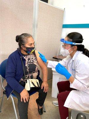 A patient gets their COVID-19 vaccine at an Eisner Health clinic!