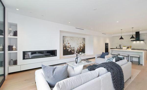 Media drawers are electric opening/closing. White their quartz top they double as additional seating for parties.