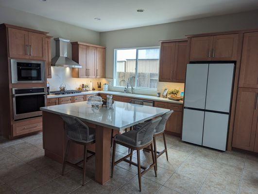 Full view of our kitchen. We've had many friends gather since the remodel and I love that our family dinners are at the island.