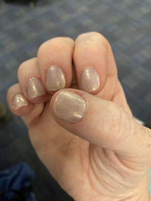 Manicure with neutral colored nail polish.