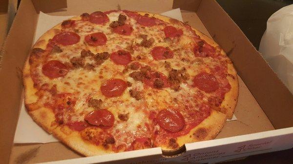 14" pie with pepperoni and sausage, still trying look for the extra cheese I paid an extra buck for.