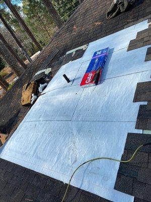 The underlayment goes under the shingles to protect the house from leaks.