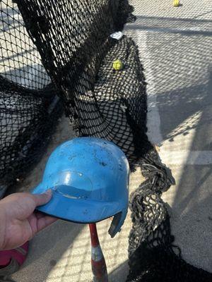 Helmet and bat that was provided by the batting cages.