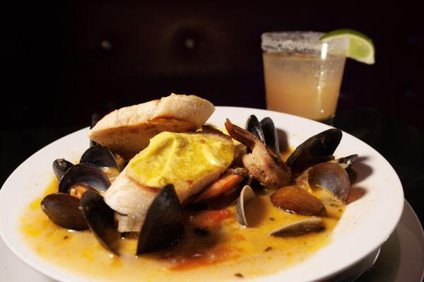 Bouillabaisse, catch of the day chunks, mussels, clams, and shrimp with fish brother topped with toasted french baguette and saffron aioli