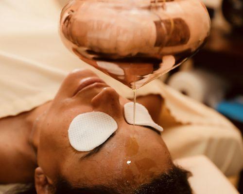 Shirodhara Treatment being performed at Ayutherapy Ayurveda Wellness Center