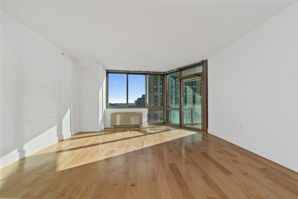 Sunny Southern Facing Living Room with Direct Waterfront Views, Renovated Open Kitchen and New Floors (1 Bedroom '11 Line)