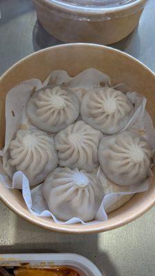 Pork soup dumplings. Lukewarm soup that was also overly sweet. Skin was thicker than the mala. Mediocre.