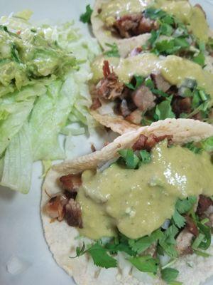 Best Carnitas tacos covered in their signature creamy jalapeno salsa!