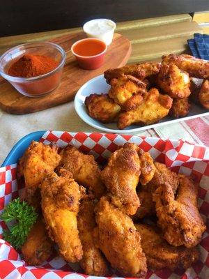 A nice comparison of our signature Breaded Wings in the foreground and our Traditional Wings in the back.