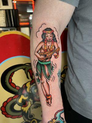 Bright and bold color American traditional hulagirl tattoo designed by Sailor Jerry in Honolulu.